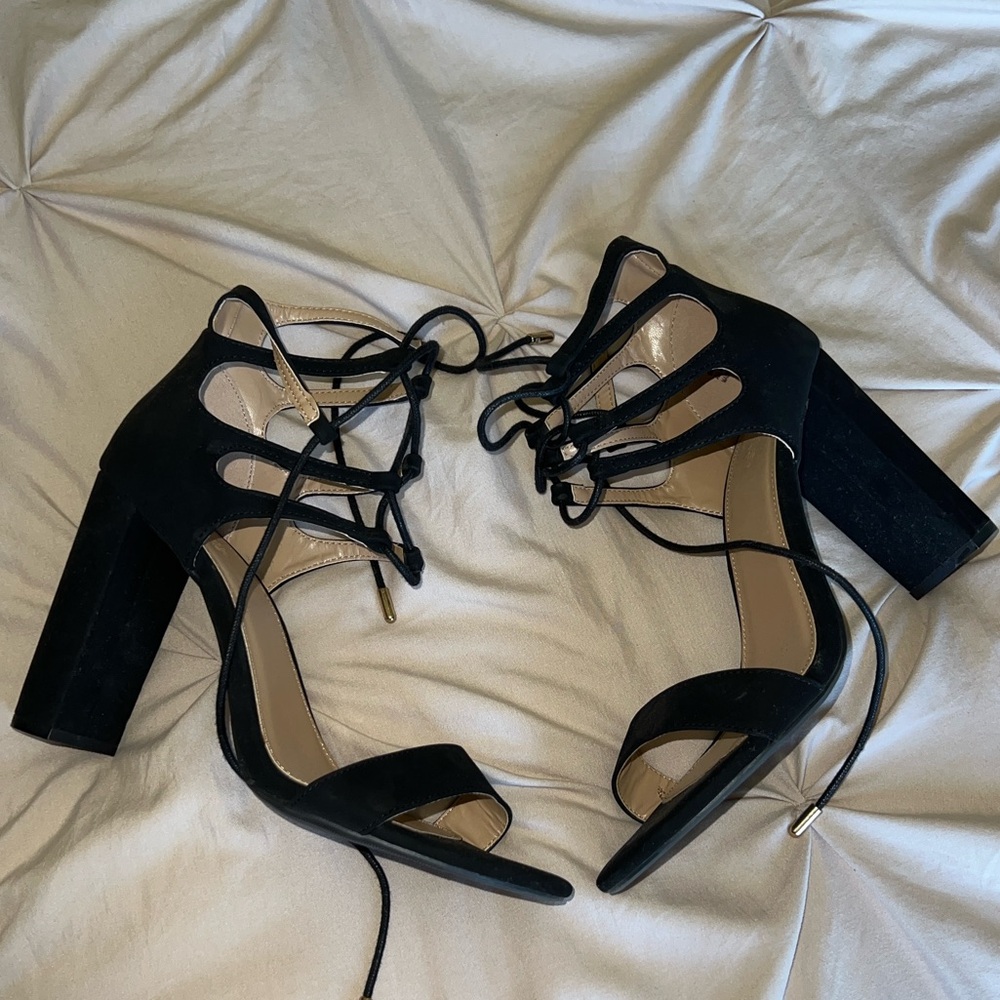 Black heels. The black is a velvety material
